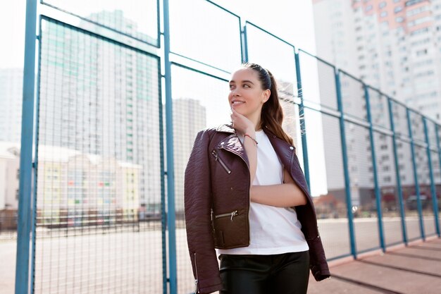 Portrait of wonderful white model with bright makeup expressing energy in good day in the metropolis