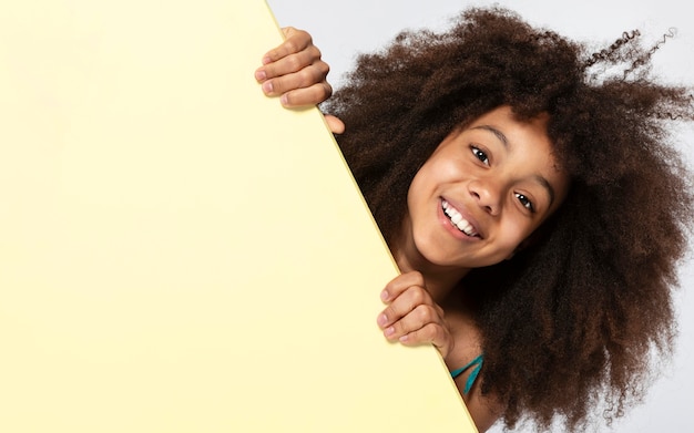 Portrait of young adorable girl posing in a cute top