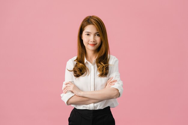 Portrait of young Asia lady with positive expression, arms crossed, smile broadly, dressed in casual clothing and looking at camera over pink background.