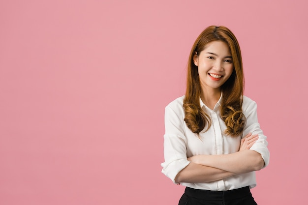 Portrait of young Asia lady with positive expression, arms crossed, smile broadly, dressed in casual clothing and looking at camera over pink background.