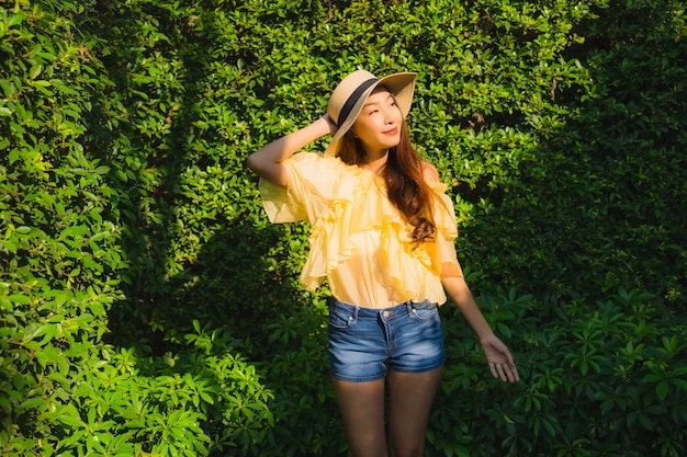 Portrait young asian woman happy smile relax around outdoor nature garden