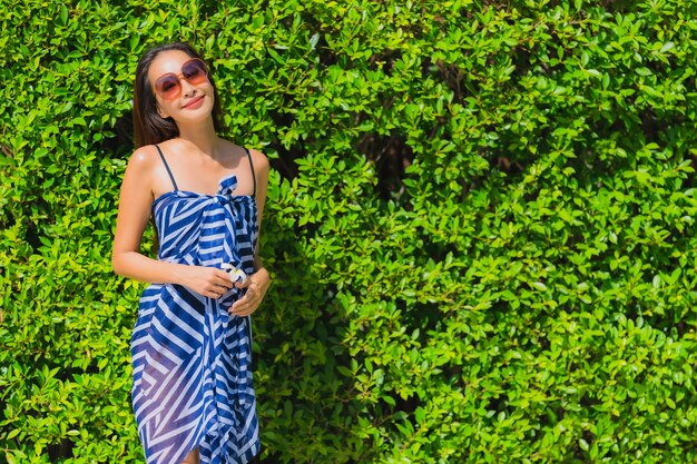 Portrait young asian woman smile happy relax in the garden