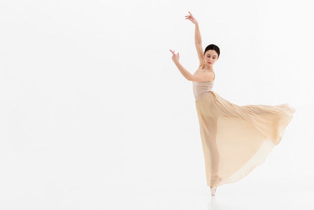 Portrait of young ballerina performing dance