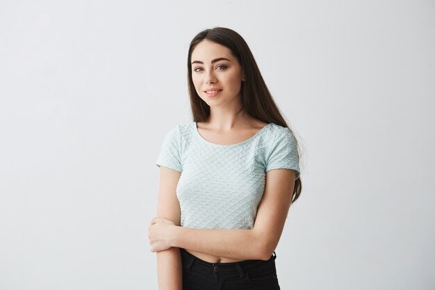 Portrait of young beautiful brunette girl smiling posing .