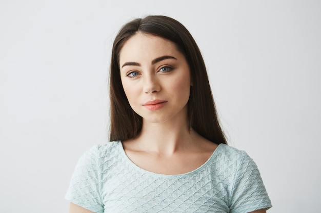 Free photo portrait of young beautiful brunette girl smiling .