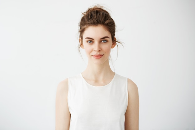 Portrait of young beautiful brunette woman smiling