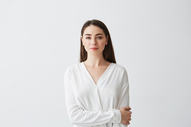 Portrait of young beautiful businesswoman smiling .