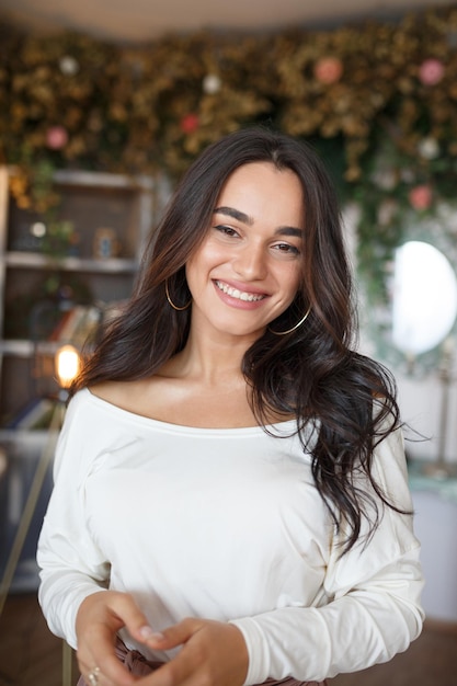 Portrait of young beautiful model stand on and smiling to the camera High quality photo