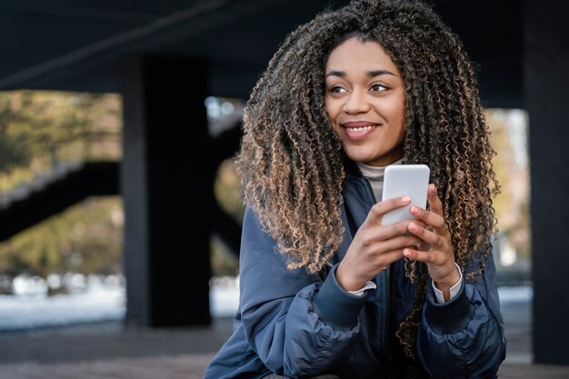 Portrait young beautiful woman using mobile