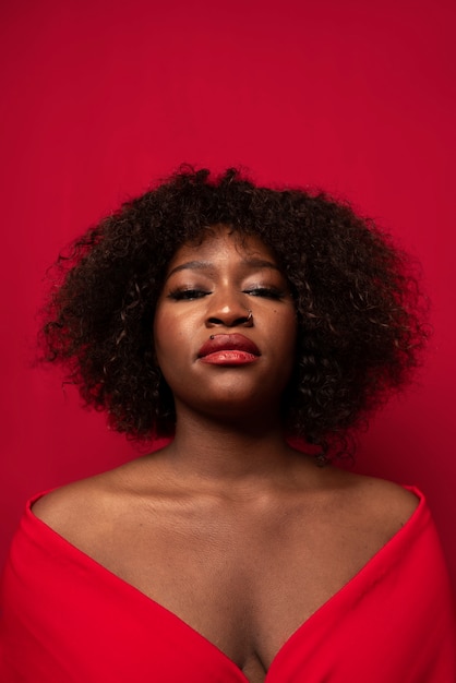 Portrait of young beautiful woman with red dress