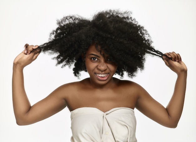 Portrait of a young black african american woman smiling with braces