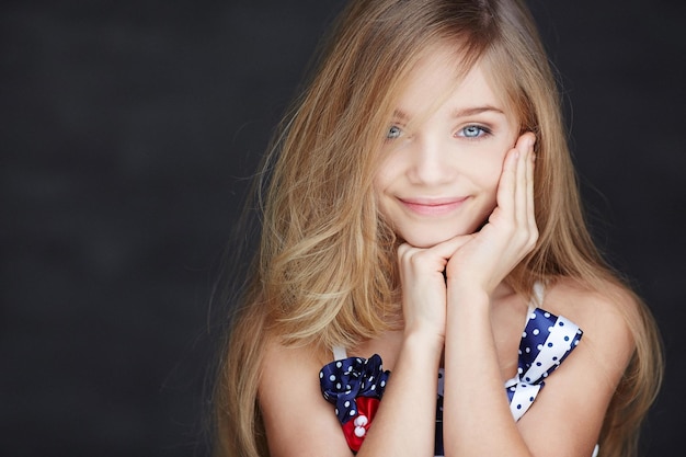 Portrait of young blond girl with blue eyes.