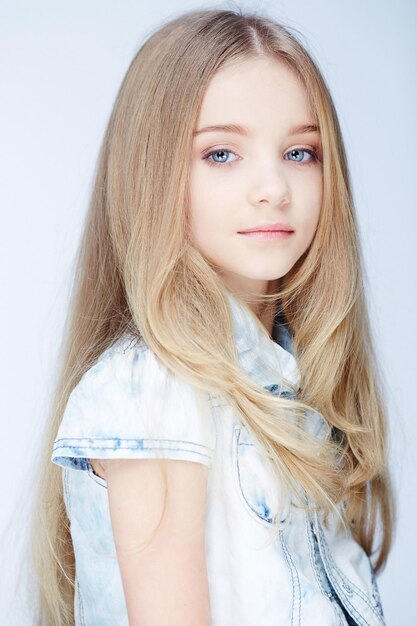 Portrait of young blond girl with blue eyes.