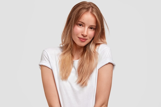 Portrait of young blonde woman in white T-shirt