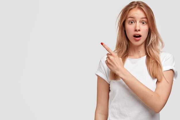 Portrait of young blonde woman in white T-shirt