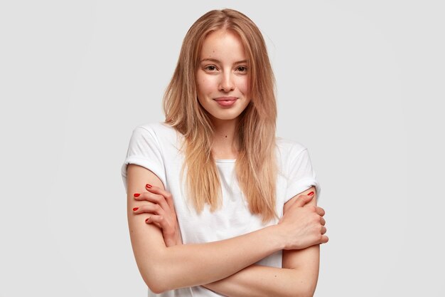 Portrait of young blonde woman in white T-shirt