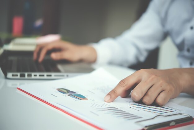 Portrait of young business man sitting at his desk