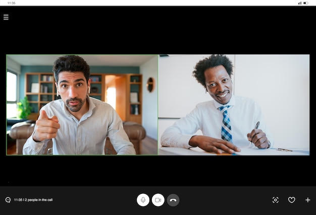 Free photo portrait of young business man on a work video call while staying at home