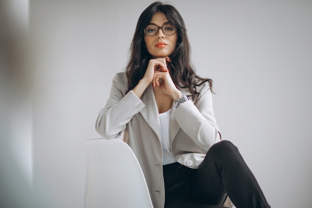 Portrait of a young business woman sitting in office