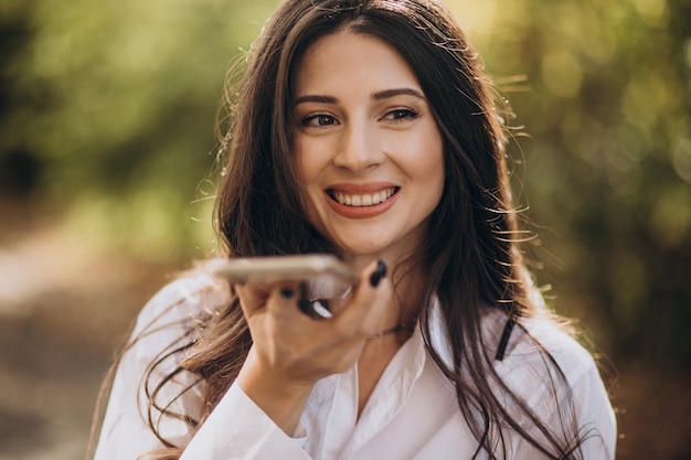 Portrait of a young business woman using phone