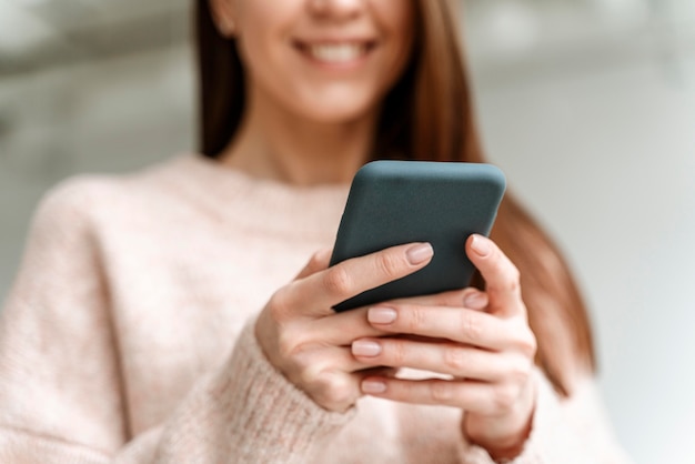 Portrait young business woman with mobile