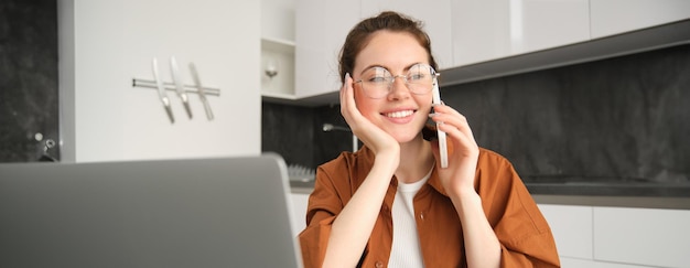 Free Photo portrait of young businesswoman selfemployed lady working from home making phone calls to clients