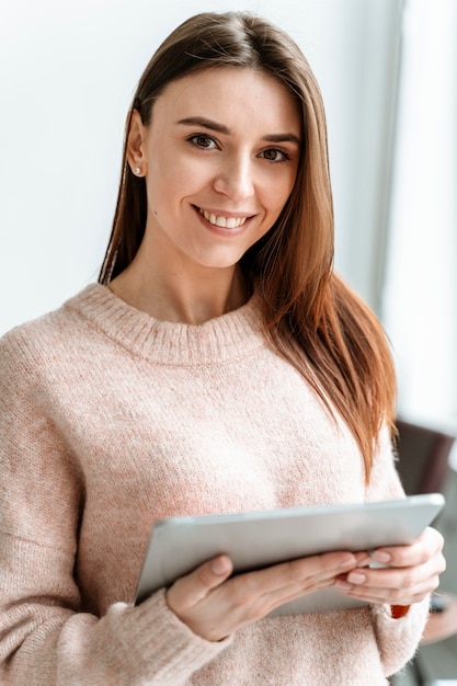 Portrait young businesswoman with tablet