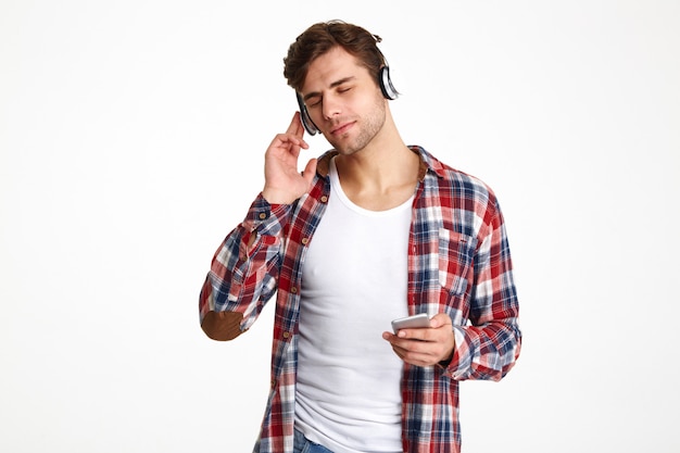 Portrait of a young casual man in headphones