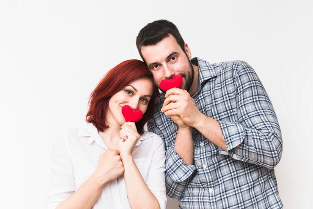 Portrait of a young couple with red heart