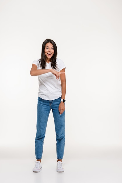 Portrait of a young excited woman standing