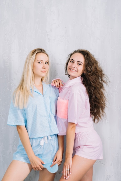 Free Photo portrait of young female friends with sleeping eye mask