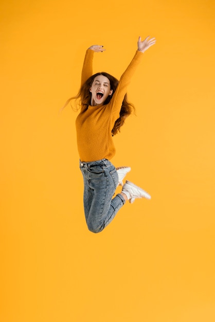 Free Photo portrait young female jumping