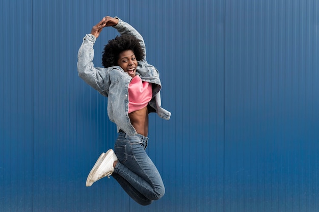 Portrait young female jumping