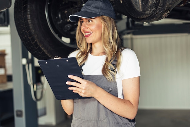 Free Photo portrait young female mechanic working