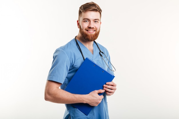 Free Photo portrait of a young friendly doctor or nurse with stethoscope