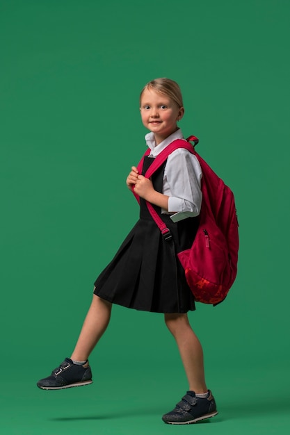 Free Photo portrait of young girl student in school uniform