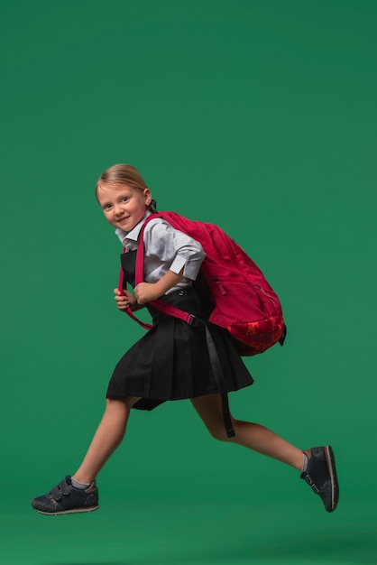 Free Photo portrait of young girl student in school uniform