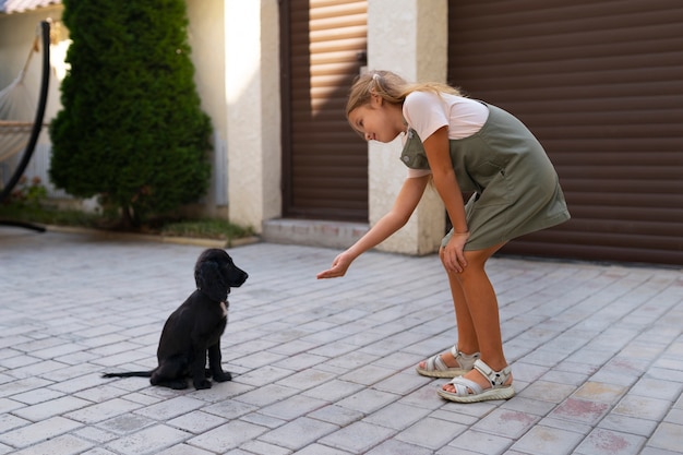 Free photo portrait of young girl with her pet dog