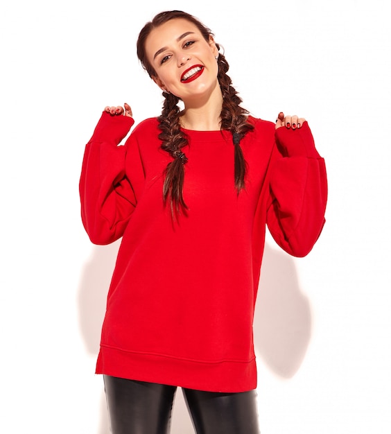 Portrait of young happy smiling woman model with bright makeup and colorful lips with two pigtails and sunglasses in summer red clothes isolated. 