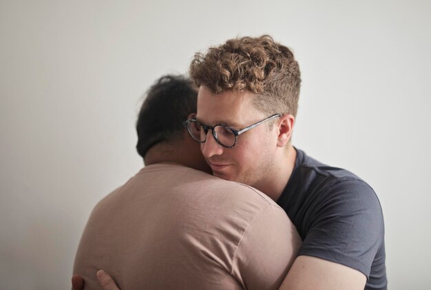 portrait of young homosexual couple embraced