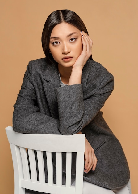 Free photo portrait young japanese woman with chair