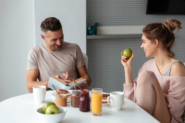 Portrait of a young loving couple having breakfast