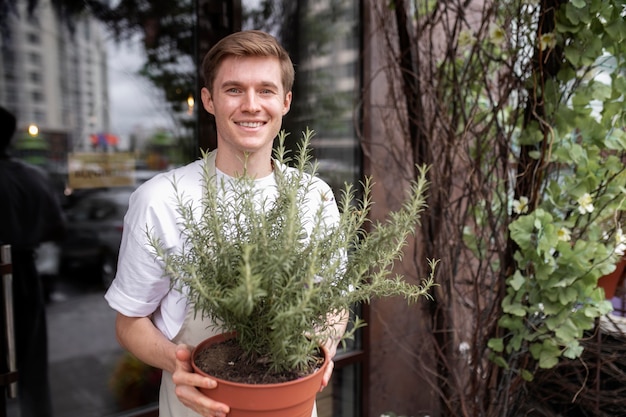 Free photo portrait of young male florist at work