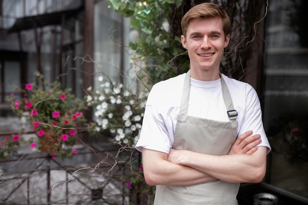 Free photo portrait of young male florist at work