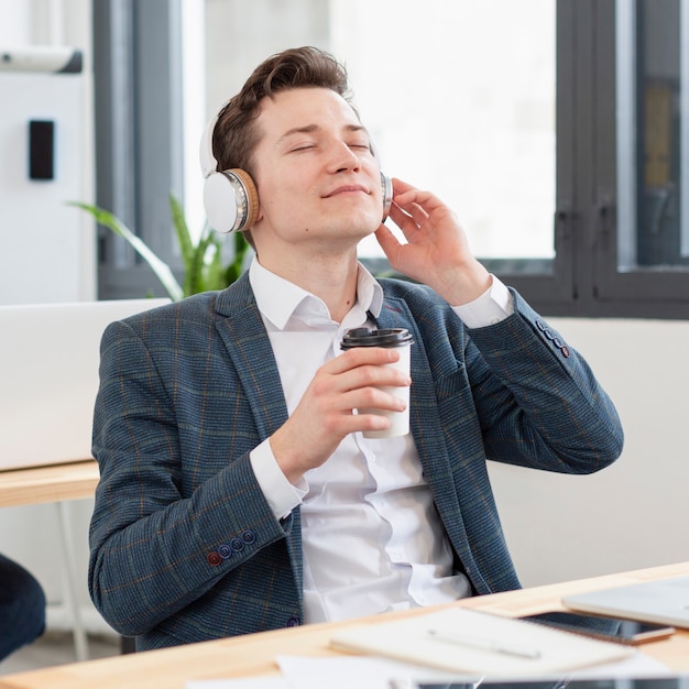 Portrait of young male listening to music