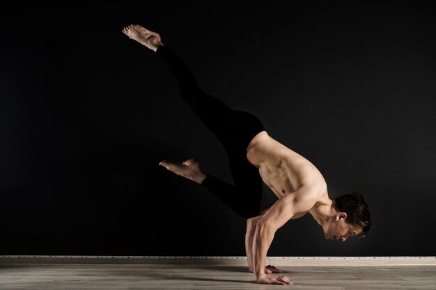 Portrait of young male model exercising