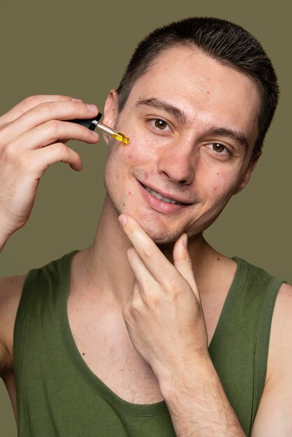 Free Photo portrait of young man being confident with acne