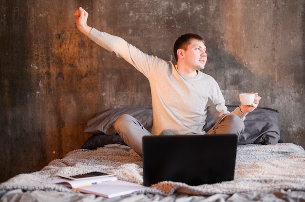 Portrait of young man casually working from home