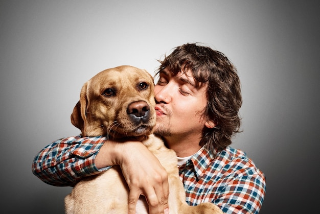 Portrait of young man and his cute dog