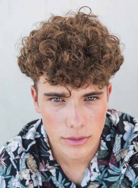 Portrait of a young man looking at camera